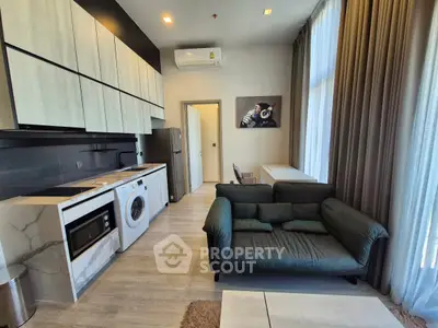 Modern living room with integrated kitchen and stylish decor