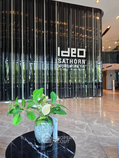 Luxurious lobby entrance of Ideo Sathorn Wongwian Yai with elegant decor and modern design.