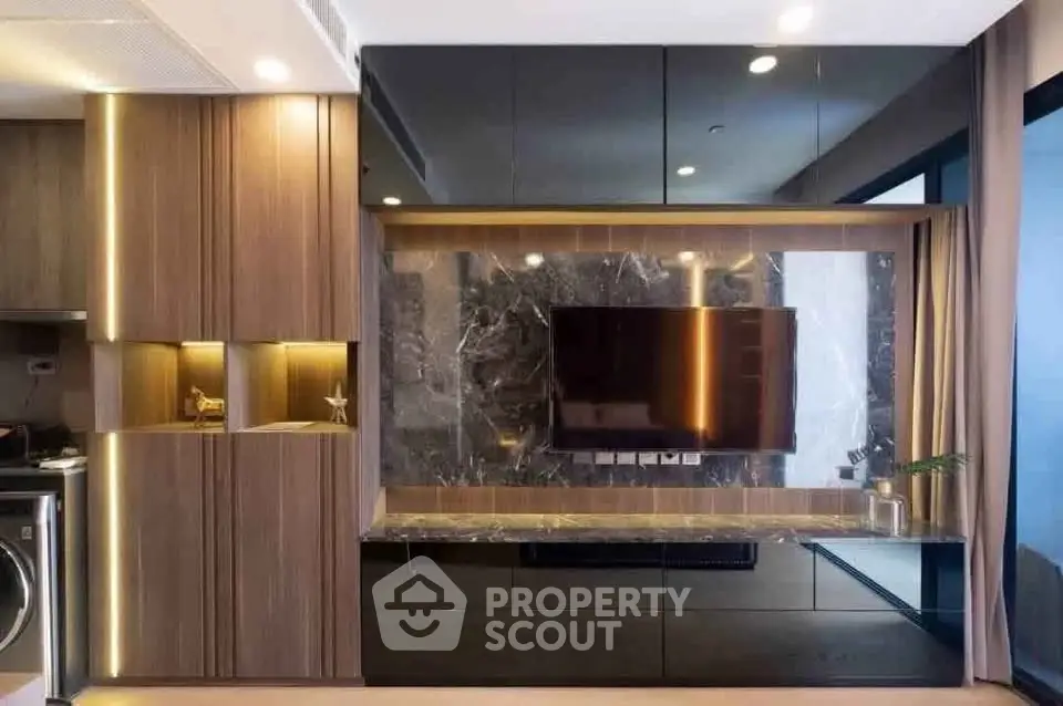Modern living room with sleek built-in cabinets and wall-mounted TV