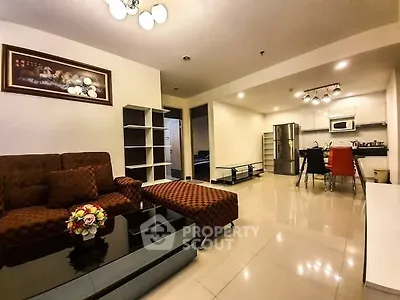 Spacious open-plan living room with modern kitchen and stylish decor
