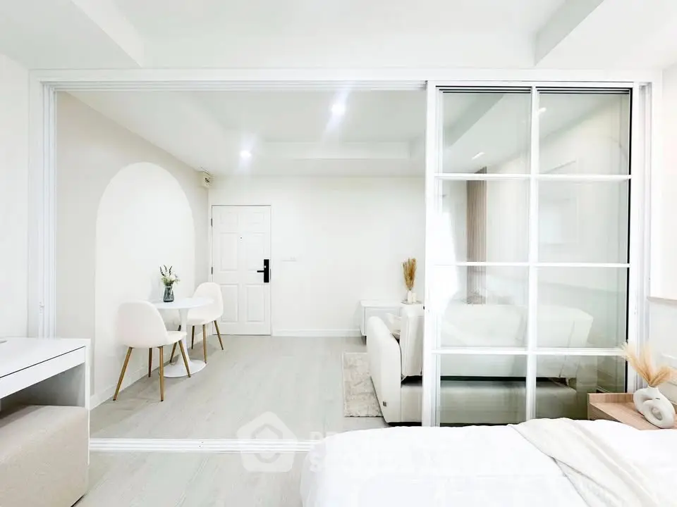 Modern minimalist interior with sliding glass doors and elegant white decor