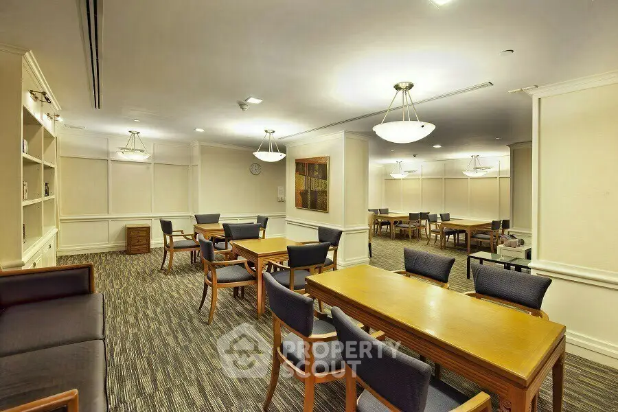 Spacious and elegant communal area with modern furnishings and ambient lighting, perfect for gatherings.