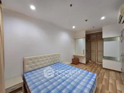 Spacious bedroom with modern design and ample storage space