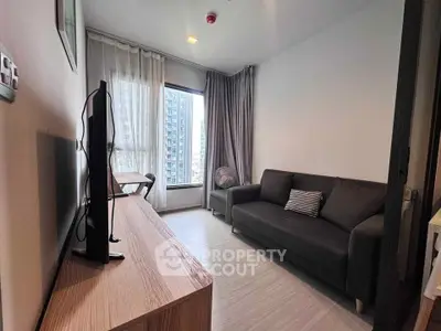 Modern living room with sleek furniture and city view, perfect for urban living.