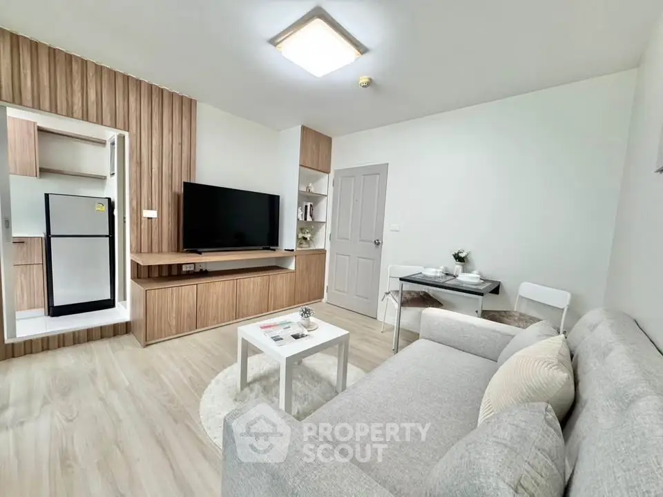 Modern living room with sleek design and open kitchen layout