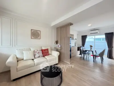 Modern open-plan living room with stylish decor and dining area