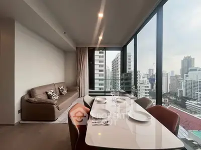 Modern high-rise apartment with stunning city view and elegant dining area.