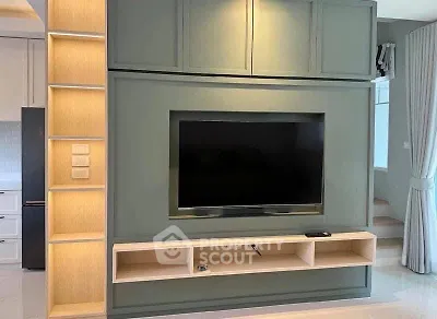 Modern living room with built-in TV unit and stylish shelving