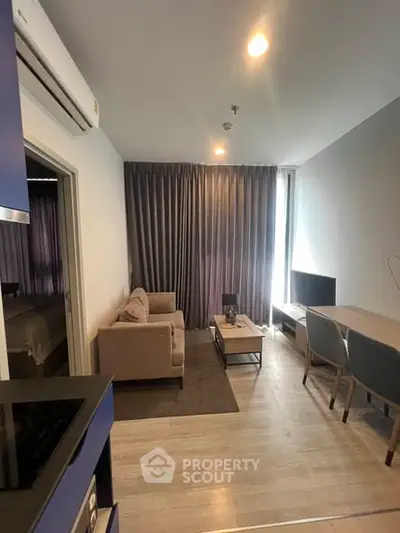 Modern living room with cozy sofa and dining area in stylish apartment