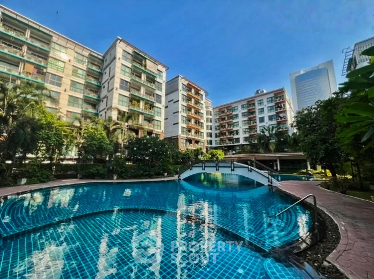 Luxurious residential complex with stunning pool and lush gardens