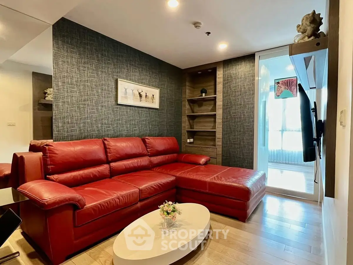 Stylish living room with red leather sofa and modern decor