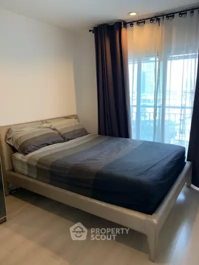 Cozy bedroom with modern decor and city view from window