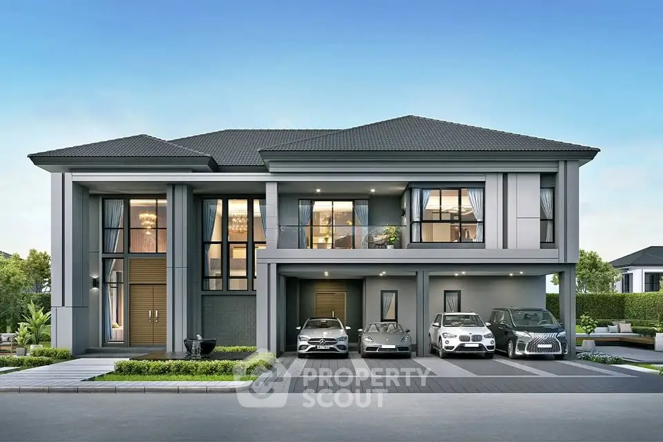 Luxurious modern house with multiple car garage and elegant facade.