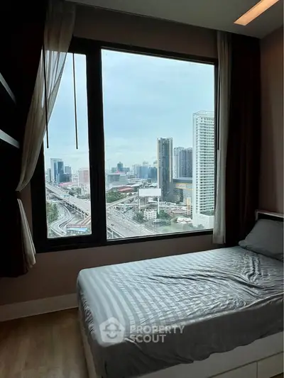 Modern bedroom with stunning city view from large window, featuring sleek design and cozy ambiance.