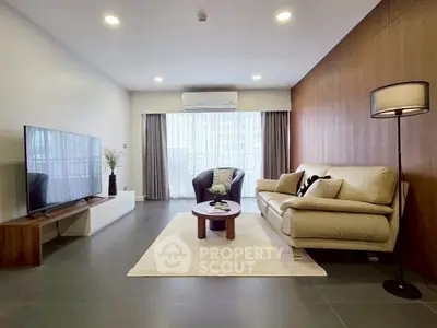 Spacious modern living room with elegant decor and natural light