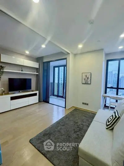 Modern living room with balcony view and stylish decor