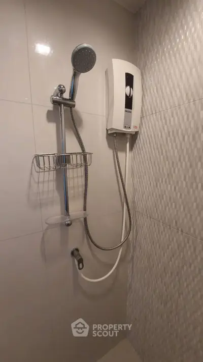 Modern bathroom with sleek shower and water heater installation.