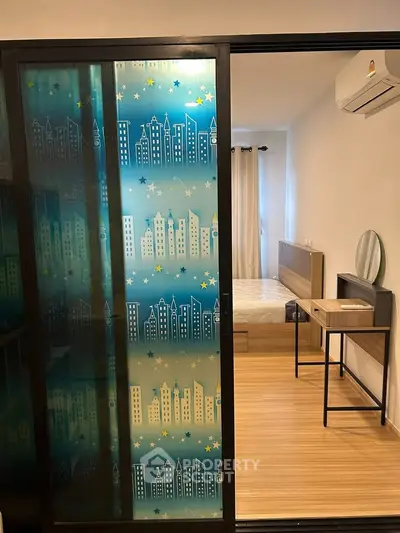 Modern bedroom with sliding glass door and stylish decor in urban apartment