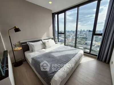 Luxurious bedroom with stunning city view and modern decor