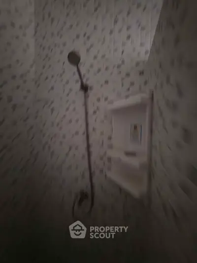 Modern bathroom shower with stylish tile design and built-in shelf
