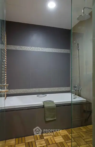 Modern bathroom with sleek bathtub and rainfall showerhead