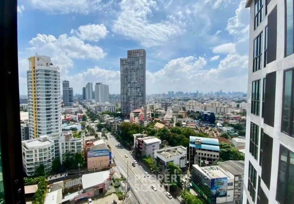 Stunning cityscape view from high-rise building showcasing urban skyline and vibrant city life.