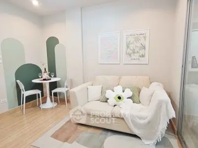 Charming living room with cozy sofa and stylish decor, perfect for relaxation and entertaining.
