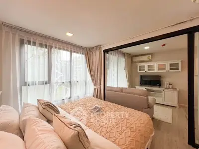 Cozy bedroom with large windows and stylish decor in modern apartment