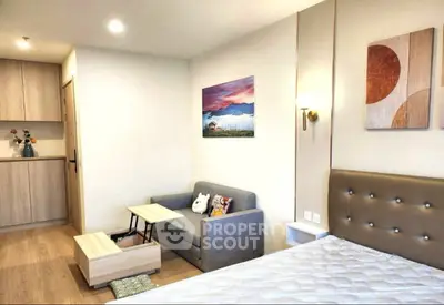 Modern studio apartment with cozy living area and stylish decor