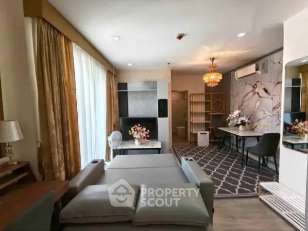 Luxurious living room with elegant decor and spacious layout, featuring modern furniture and stylish lighting.