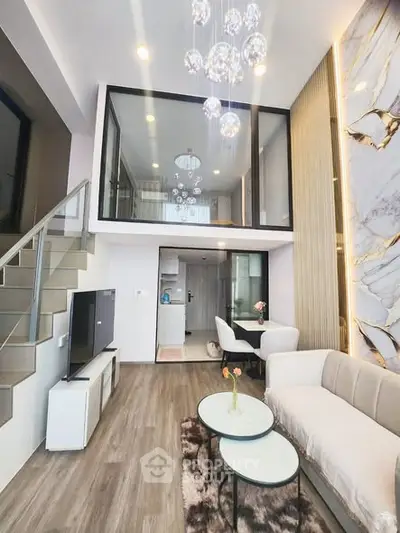 Luxurious modern living room with mezzanine, elegant decor, and stylish furniture