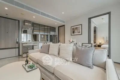 Luxurious open-plan living room with modern kitchen and elegant decor