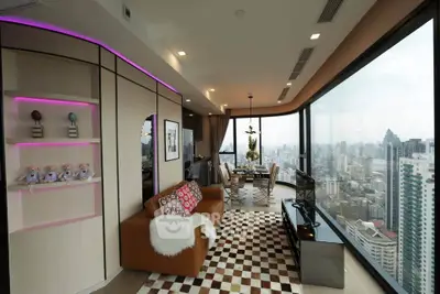 Luxurious corner unit with panoramic city views and stylish modern interior design.