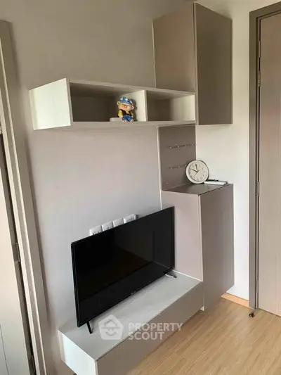 Modern living room with sleek TV unit and stylish storage cabinets