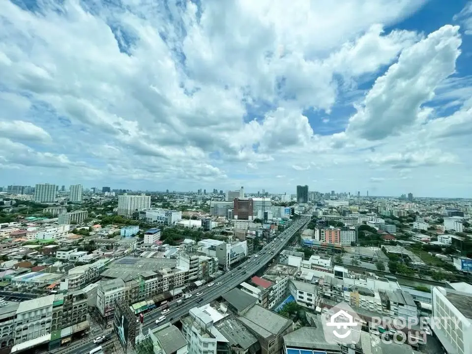 Stunning cityscape view from high-rise building showcasing urban skyline and expansive horizon.