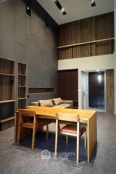Modern living room with high ceilings and stylish wooden furniture