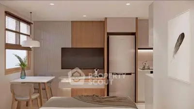 Modern studio apartment with stylish decor, featuring a cozy dining area, wall-mounted TV, and sleek kitchen appliances.
