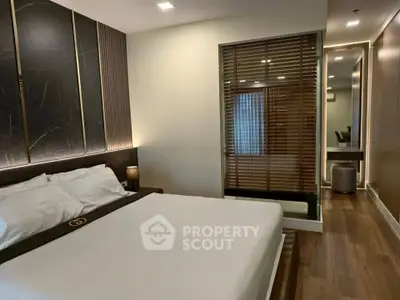 Luxurious modern bedroom with elegant decor and wooden flooring