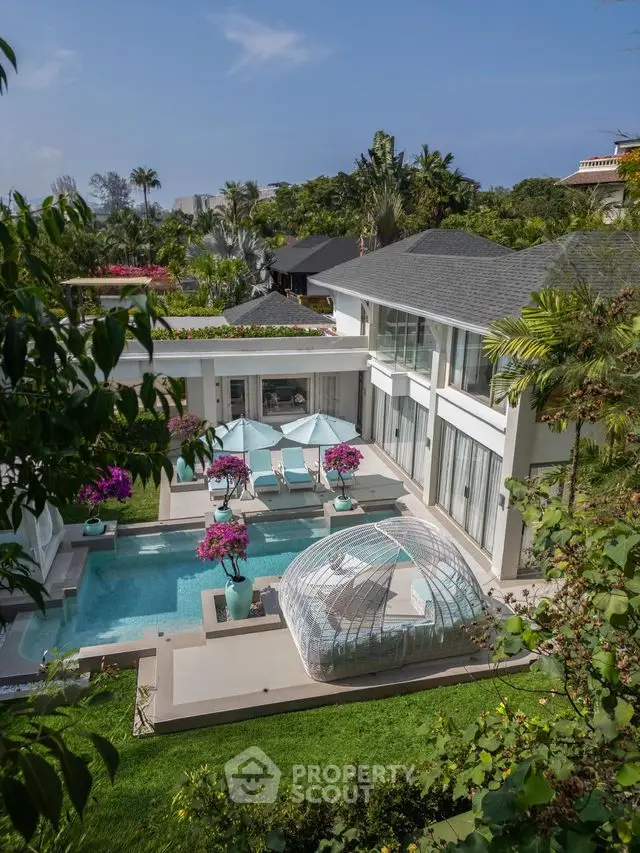 Luxurious modern villa with private pool and lush garden, perfect for serene living.
