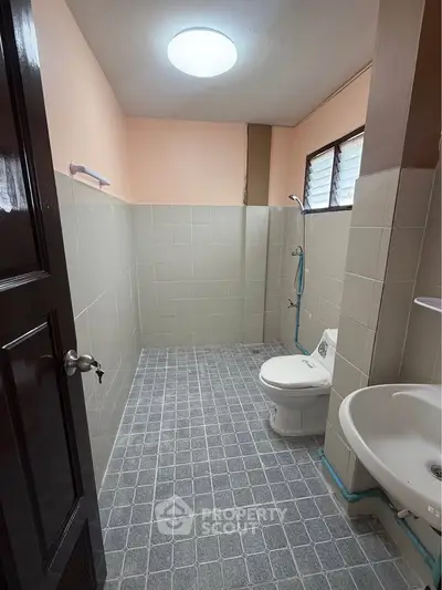 Spacious bathroom with modern fixtures and natural light