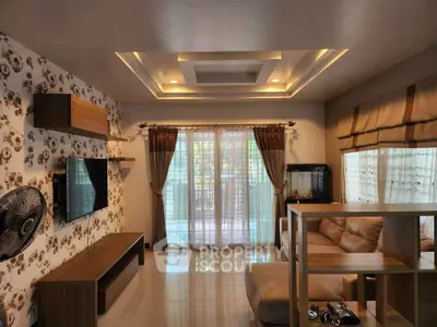 Spacious living room with modern decor and large windows for natural light.