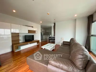 Spacious modern living room with open kitchen and stylish furnishings