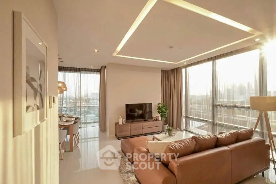 Luxurious living room with modern decor and stunning city view