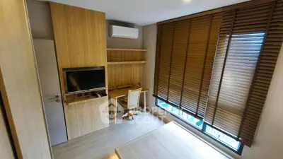 Modern study room with wooden decor and large window blinds