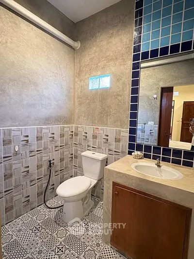 Modern bathroom with stylish tile design and sleek fixtures