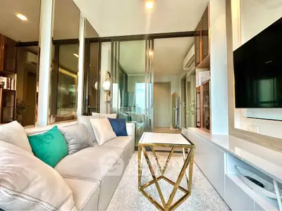 Modern living room with stylish decor and large windows