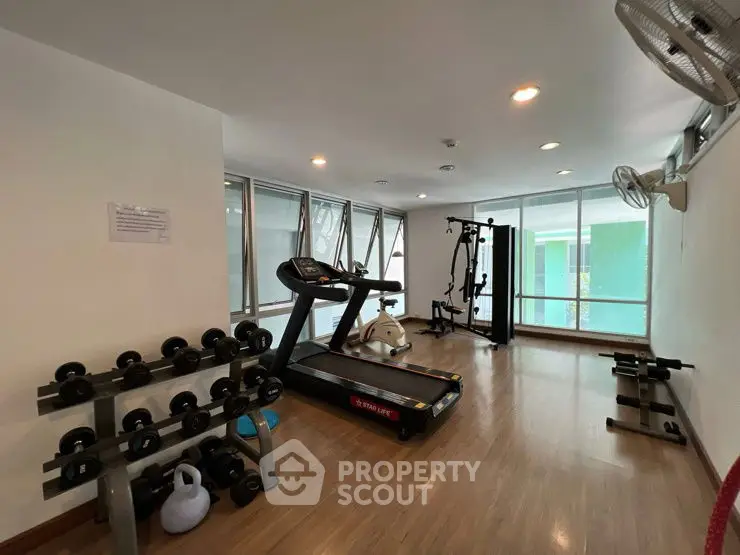 Spacious home gym with modern equipment and natural light