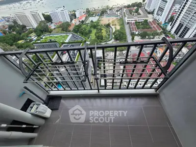 High-rise balcony with stunning city and sea view, perfect for urban living.