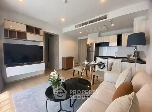 Modern living room with open kitchen and stylish decor