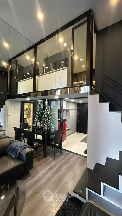 Modern duplex living room with elegant decor and Christmas tree